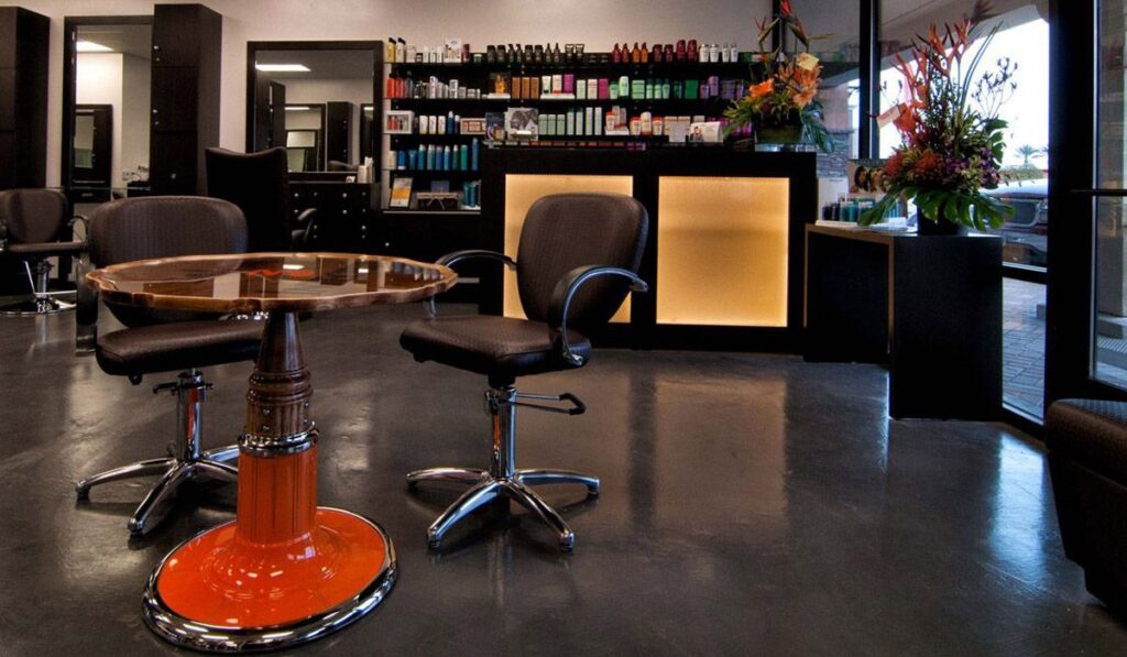 Dark natural wood and soft fluorescent bulbs create a neutral interior and lighting so you see exactly how your color will look outside the salon.