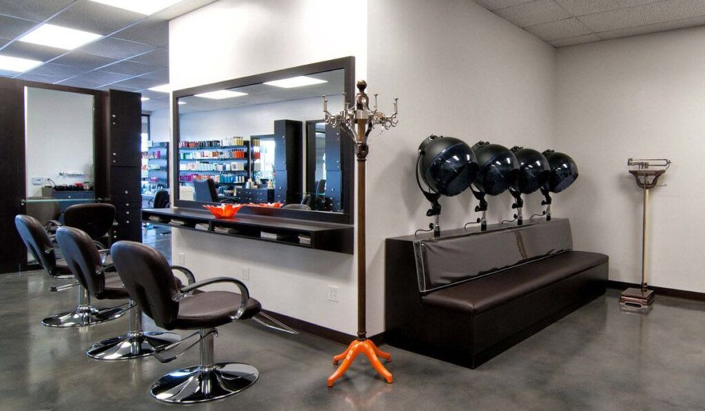 Back area of salon with stations and custom dryer bench